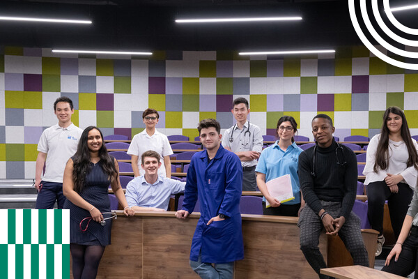 Health students stood together in lecture theatre